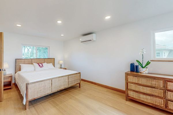 Second Bedroom features king bed dresser and soft natural window light
