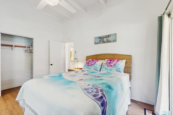 Inviting sleeping area pairs plush bedding with thoughtful touches and restful ambiance
