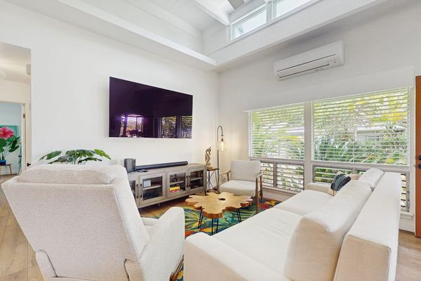 Open living area welcomes evenings with generous seating and artwork
