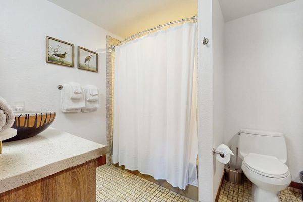 Bright Full Bathroom With Shower Tub Combo