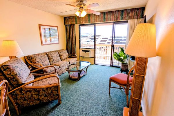 Comfortable living room with a private lanai and ocean views