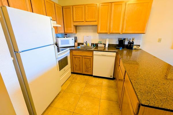 Spacious kitchen with ample counter space and modern appliances