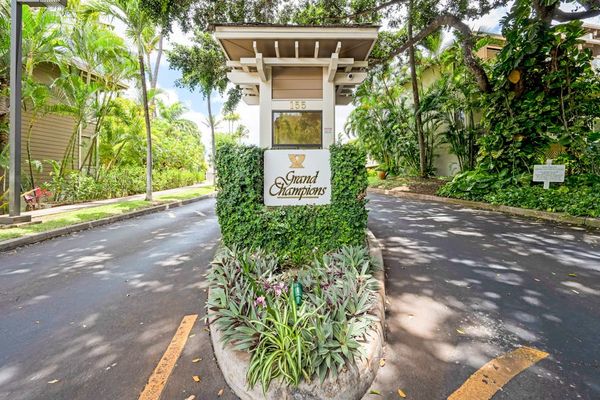 Welcoming property entrance surrounded by lush greenery