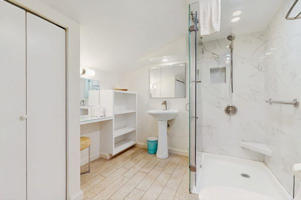 Guest bathroom with walk-in tiled shower.