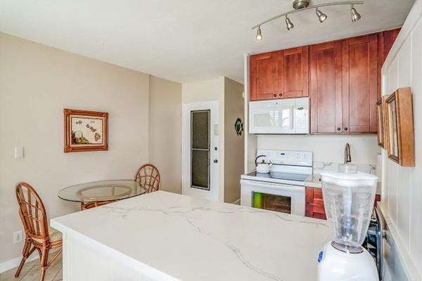Full kitchen and a dining table for two.