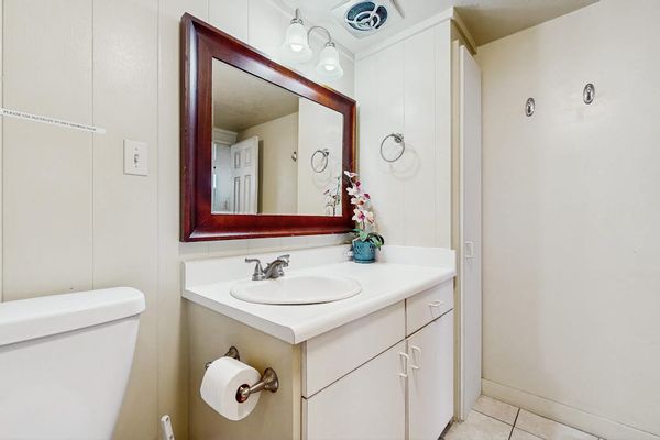 Primary bathroom with tiled walk in shower.