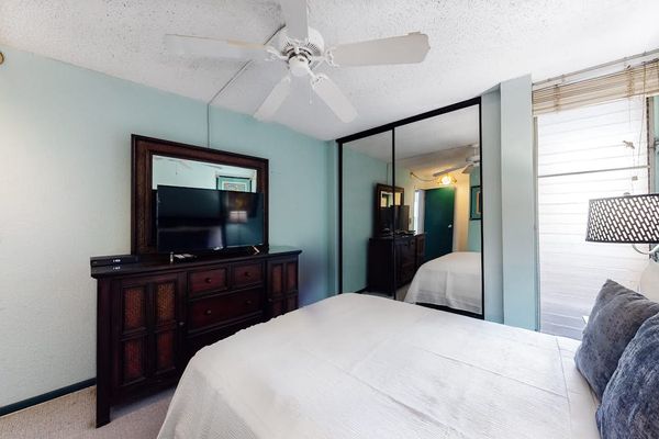 Master Bedroom with king bed and a flat screen tv.