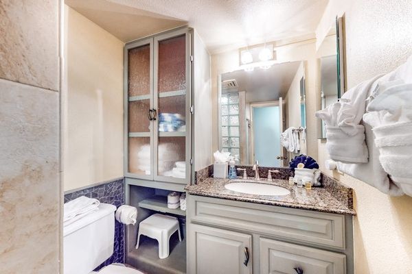 Guest bathroom equipped with modern vanity and walk-in shower