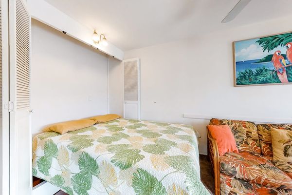 Cozy sleeping area with tropical touches creates a warm and relaxing setting for a restful night