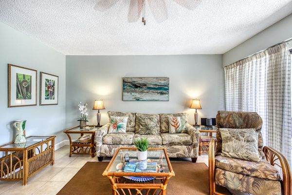 Inviting living room features generous seating and easy outdoor access