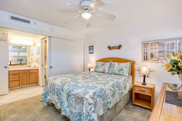 Peaceful queen bedroom with ample storage