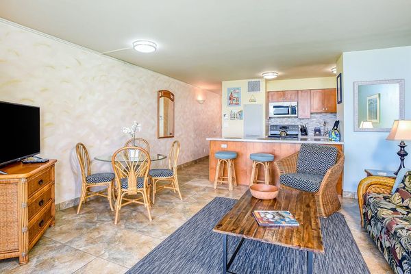 Cozy open-concept living space with a dining area and a full kitchen