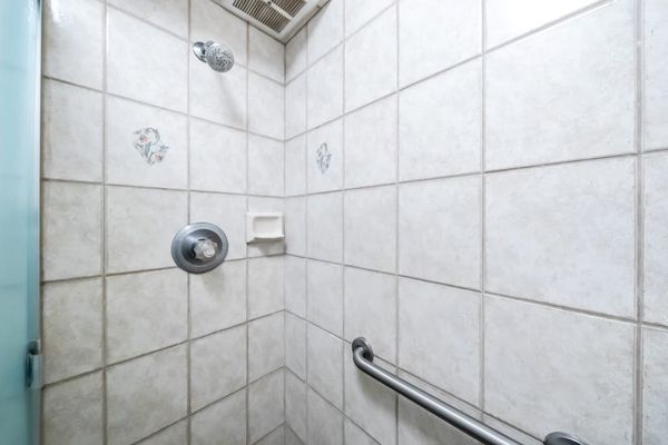 Clean And Spacious Shower Area Stocked For Guests
