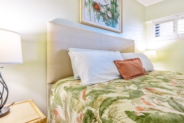 Sunlit Bedroom Haven Complete With Cozy Reading Lamps