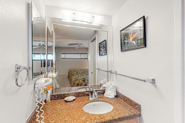 Bright, updated bathroom featuring a spacious tiled walk-in shower and modern finishes.