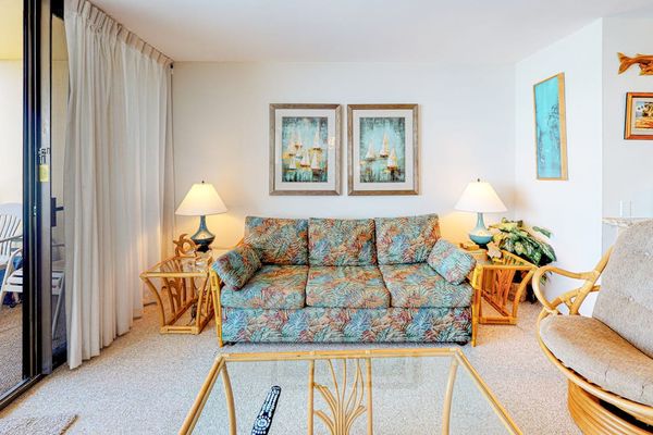 Open living room with lots of natural light and a sofa bed for extra company.