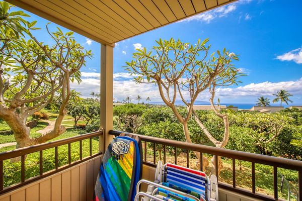 Balcony View with Beach Gear and Tropical Garden Surroundings