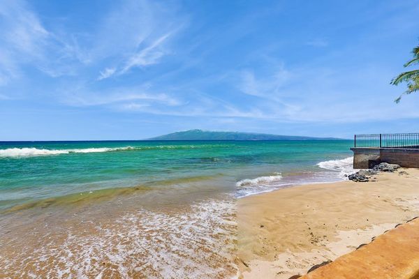 Enjoy direct access to a beautiful sandy beach with crystal-clear waters and island views.