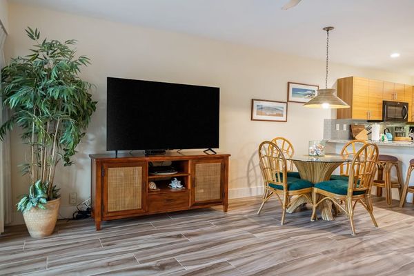 Open lounge area welcomes conversations beneath breezy ceiling fans daily
