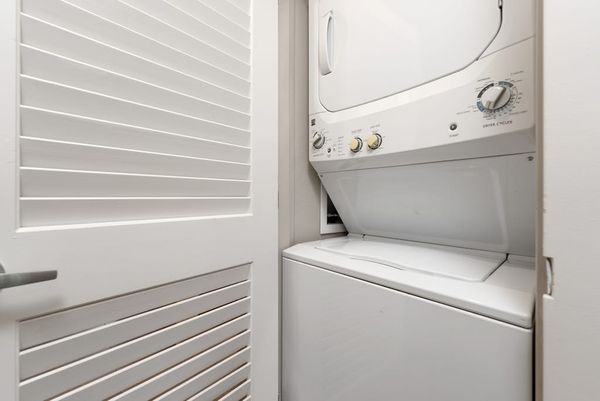 Washer and dryer are conveniently tucked inside a dedicated closet