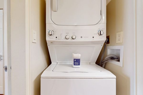 Stacked In-Unit Washer and Dryer Set with Laundry Detergent Provided