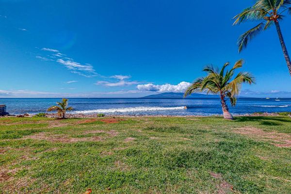 Enjoy peaceful ocean views across the resort's open green space.