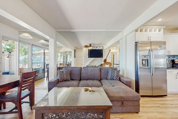 Relax in the bright open-concept living room with seamless indoor-outdoor living.