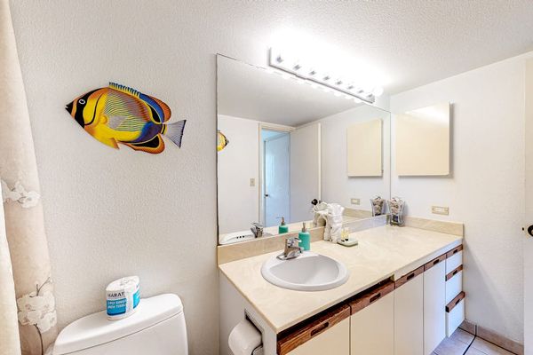 Spacious primary bathroom with plenty of counter and drawer space for your essentials