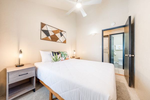 Primary bedroom with coastal-inspired decor