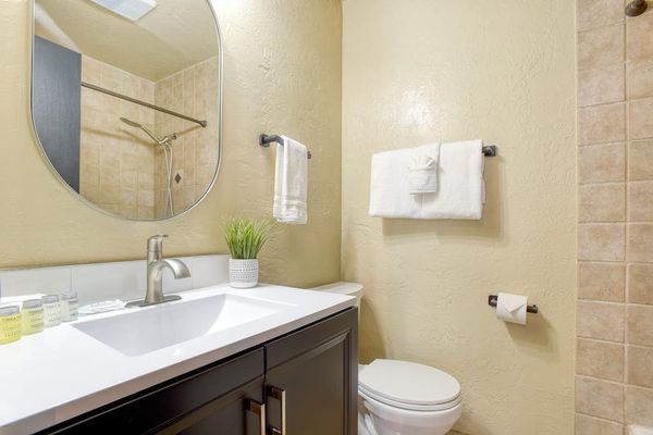 Bathroom with double vanity and elegant finishes