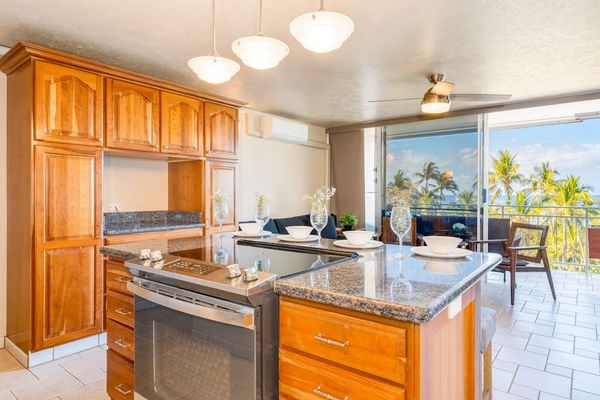 Fully equipped kitchen featuring modern appliances and ocean views