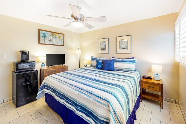 Guest room with king bed and a flat screen tv for your entertainment.