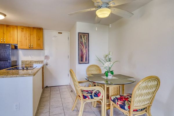 Open-concept dining space connects seamlessly to the fully equipped kitchen for added convenience.