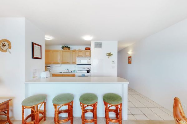 Barstools with extra seating at the kitchen counter.