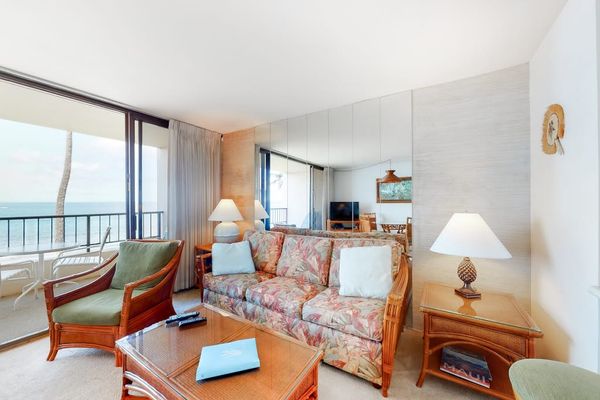 Living room with sleeper sofa and flat screen tv.