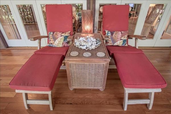 Spacious bench seating offers a relaxing spot to enjoy the tropical atmosphere