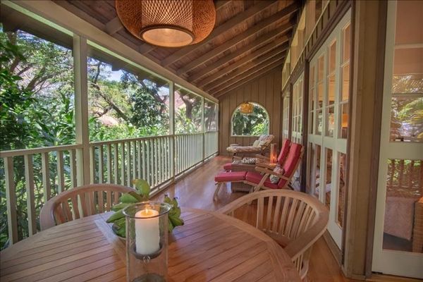 Unwind on the balcony with coffee, fresh air, and comfortable outdoor seating