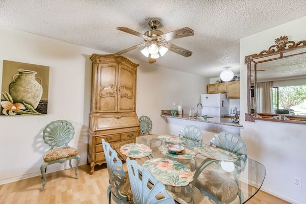 Bright dining area combines comfortable seating artwork and natural light