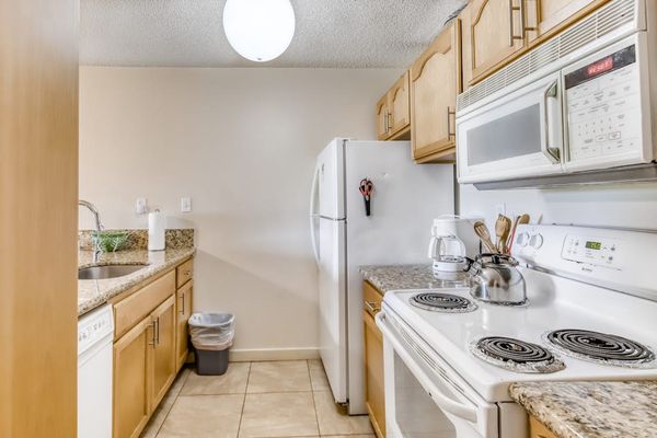 Bright living area connects comfortable seating with the kitchen space