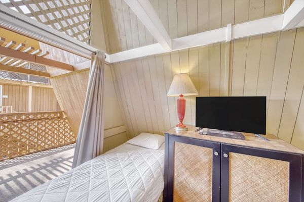 Cozy studio retreat featuring restful bed and TV for laid-back vacation evenings together