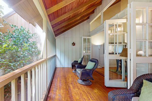 Cozy balcony seating offers a welcoming place to relax and enjoy the outdoors