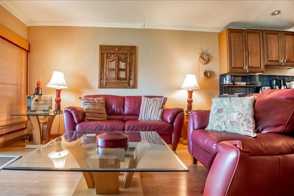 Living room offers seating television dining area and ceiling fan