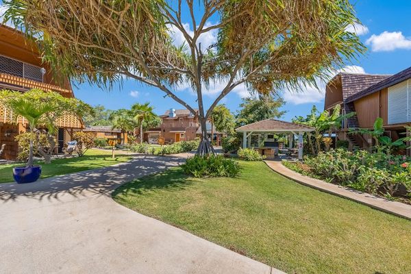 Island pathways offer easy access through bright green resort grounds