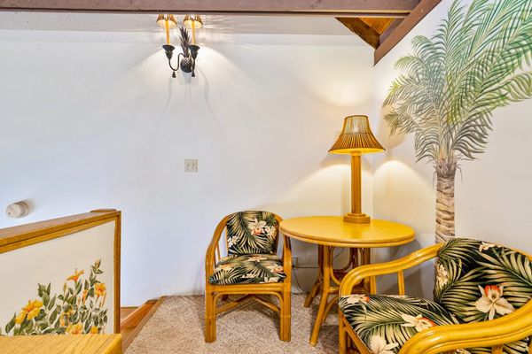 Loft dining corner highlights wood beams table seating and decor