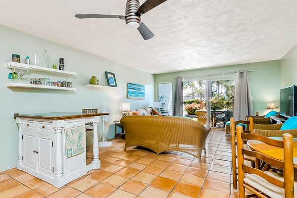 Kitchen island, dining table, and seating create a welcoming layout