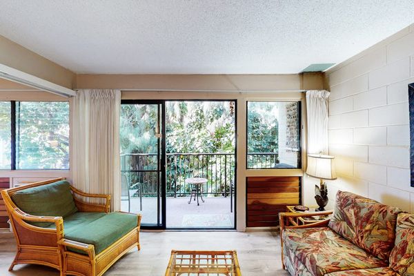 Open airy living room with flat screen tv and a pull out sofa for extra guests.