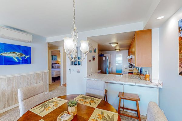 Dining room and bar stools at the counter of the kitchen for extra seating.