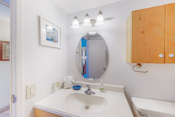 Bathroom with walk in tiled shower.