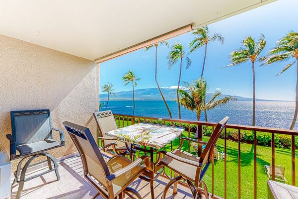 Lanai with seating with marvelous views of the turquoise blue waters of the Pacific and watching the Palm Trees swaying in the breeze.