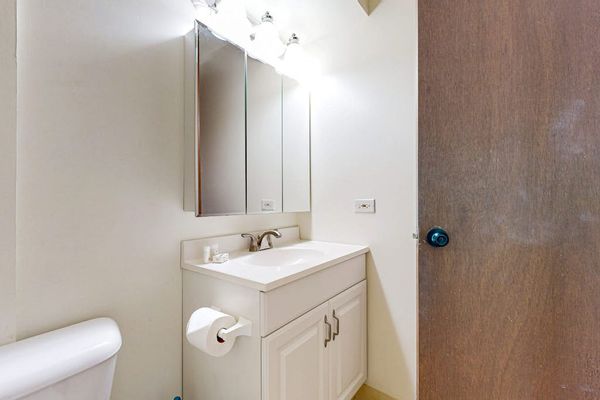 Get ready for your day in Honolulu at the well-lit bathroom vanity, which features a mirrored medicine cabinet and under-sink storage.